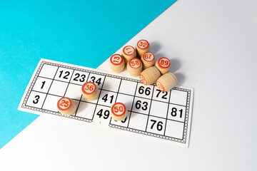 Tabletop old lotto, bingo game with cards and barrels on table. 