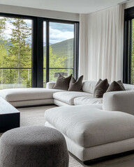 Modern living room with cozy furniture and scenic mountain views in a contemporary home setting