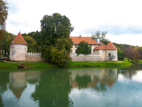 Scenic, historic Otocec castle. Beautiful Slovenian national monument. Imposing ancient fortification on a small island on the tranquil Krka river. The fortress is now a luxury hotel.
