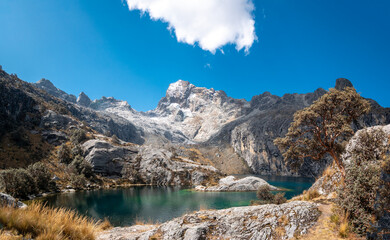 Obraz premium The Churup Lagoon with Turquoise Waters at the Foot of the Snow-Capped Cordillera Blanca is Located in the Huascaran National Park, in Ancash, Peru