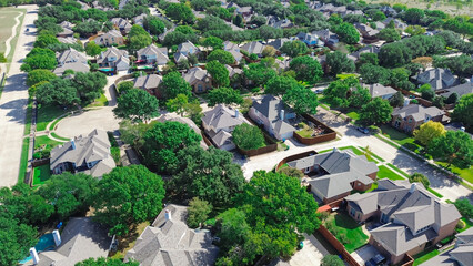 Cul-de-sac keyhole dead-end street in upscale suburban residential neighborhood cluster of new...