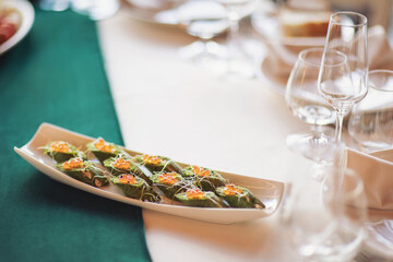 Food at the wedding table. small portions, healthy and delicious snacks, diet food. 