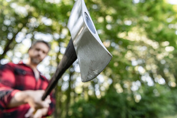 Sharp blade. Brutality and masculinity. Lumberjack with ax selective focus. Brutal lumberjack....