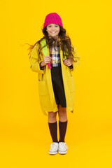 School education. Student in autumn style cloth. Stylish girl isolated on yellow. September 1. Study in college. Student girl carry backpack. Back to school. Knowledge day. Knowledge and education