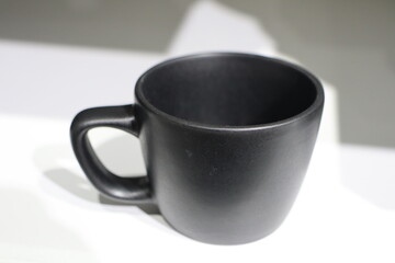 An Elegant Black Ceramic Cup that perfectly complements a Modern Aesthetic design