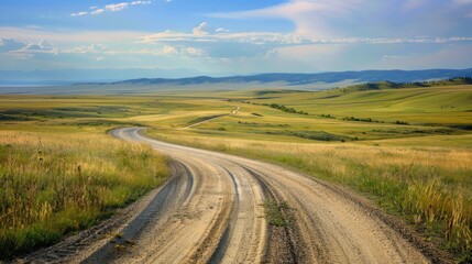 Fototapeta premium Open Range. Gravel Road Intersection in Beautiful Grassland Countryside