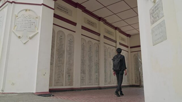 A man walks in a cemetery area of ​​Dutch soldiers in Asia