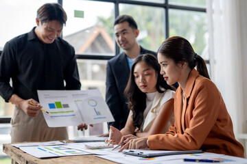 Business team analyzing financial data and developing growth strategy