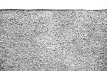 a close up of a rough  grey wall with a white texture
