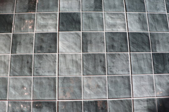 An abstract grid pattern with varied textured tiles, ideal for modern architecture