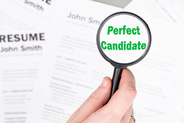 Fake mock CV (curriculum vitae) resume for John Smith, selected by HR as the perfect candidate for a job. Concept of job search, employee selection, recruitment process, work and hiring.