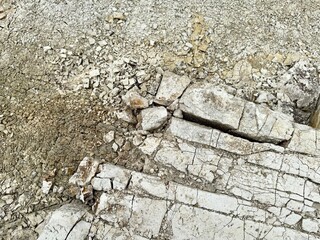 The texture of crushed limestone and cracked limestone. Limestone abstract background.