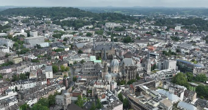 Drone footage of a view over Aachen, Germany with the town hall and the cathedral on a sunny day