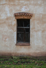 Fototapeta premium Old wooden window on the ancient abandoned house