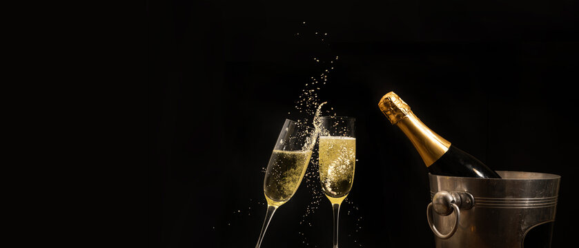 Silvester 2025 New year New Year's Eve Party, birthday or celebration background banner panorama - Champagne bucket with champagne bottle, champagne glasses for toasting isolated on black night sky