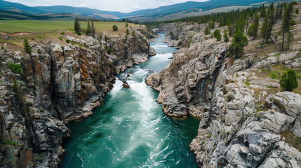 Obraz premium A stunning view of a canyon with a river
