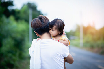 Obraz premium Loving mom and one year old baby enjoying time outside