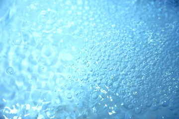 Blue water texture. Bubbles and bubbling water.