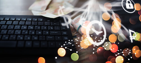 Russian rubles are on the table next to the computer, Notepad in the office or Bank. Savings and...