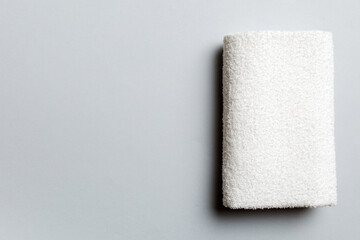 Top view of white towels with copy space on colored background