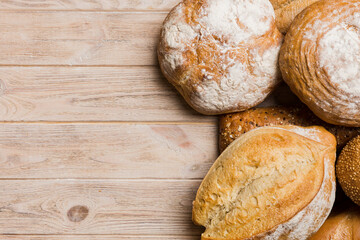 Homemade natural breads. Different kinds of fresh bread as background, top view with copy space