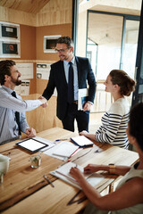 Planning, partnership and business people with handshake, collaboration and project brainstorming...
