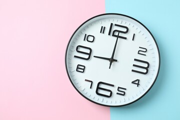 Big beautiful stylish clock on color background