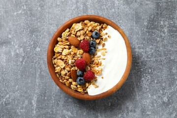 Delicious granola with berries and yogurt on the table
