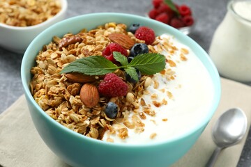 Delicious granola with berries and yogurt on the table