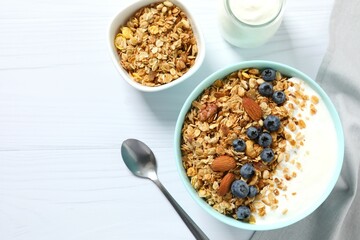 Delicious granola with berries and yogurt on the table