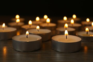 Burning candles in a dark space