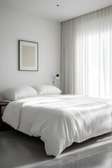 Modern minimalist bedroom design featuring a white bed and natural light in a serene setting