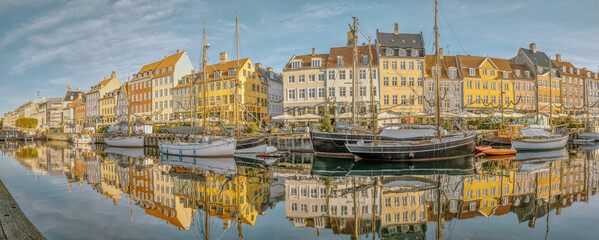 Panorama of Copenhagen New Harbour and its picturesque buildings reflected in the water