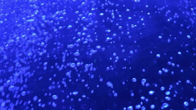 Water bubble blue oxygen air, in underwater clear liquid with bubbles flowing up on the water surface. Background.