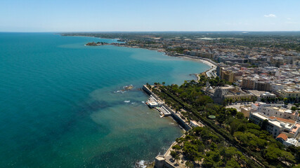 Fototapeta premium Aerial view of the municipal park of Trani, in Puglia, Italy. It is a small park located on the seafront of the city.
