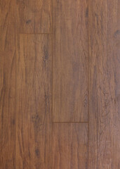 Fototapeta premium wooden floor covering in brown color. a close-up photo of the texture