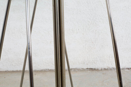 1990s vintage tubular steel and glass dining table. Interior product photograph.