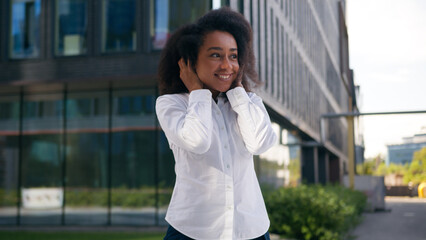 Happy African American woman amazed female businesswoman office employer rejoice emotional business achievement wonder city worker shocked celebrate winning excited girl success joyful outside triumph