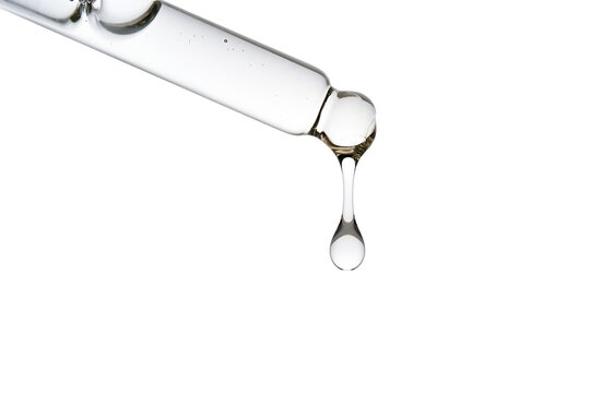 Dropper pipette with delicious serum with bubbles close-up.