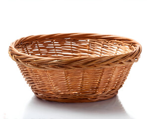 Fototapeta premium A close-up of an empty handcrafted woven basket set against a white background, highlighting its natural texture and traditional design. Ideal for storage, decoration, or gift presentation.