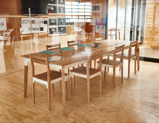 Empty room, meeting or modern workspace for business, corporate job or brainstorming. Wooden furniture, interior design or table with documents or chairs for collaboration, planning or development