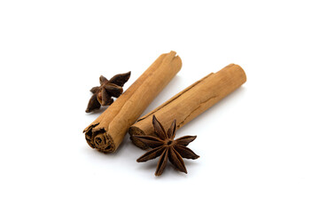 Cinnamon sticks and anise isolated on white background. Cinnamon roll and star anise. Spicy spice for baking, desserts and drinks. Fragrant ground cinnamon. Perfect for Christmas season.