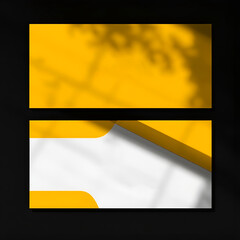 A yellow and white business card mockup displayed on a clean surface, showcasing a professional design layout.