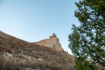 Fototapeta premium Panorama of the medieval castle of Castrojeriz built in the municipality of Castrojeriz in the 13th century, in Burgos in October 2024.