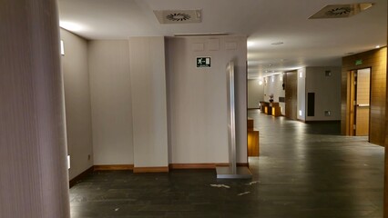 Dimly Lit Modern Hallway with Subtle Lighting Accents