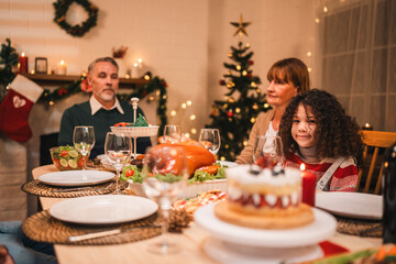 Celebrate Christmas at Home, Happy Family Dinner with Father, Mother, Children Gathered, Enjoying Festive Food Table Together, Smiling Embracing Joy of Holiday Season in a Warm Indoor Setting