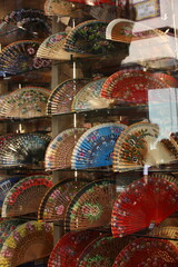 A shop window full of traditional hand fans in Seville