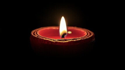 Close-up image of a Happy Diwali diya against a black background