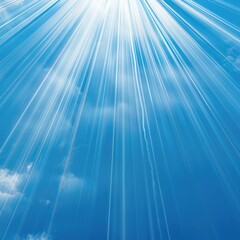 Obraz premium Bright sunlight rays pierce through a blue sky illuminating the clouds.