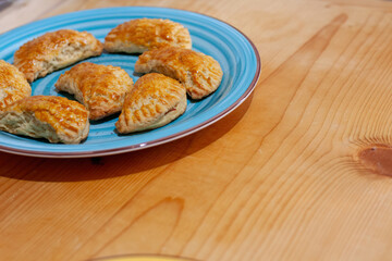 Golden Pastries on a Blue Plate
